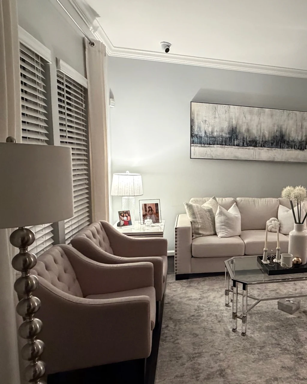 Finished formal living room with refreshed furnishings and area rug